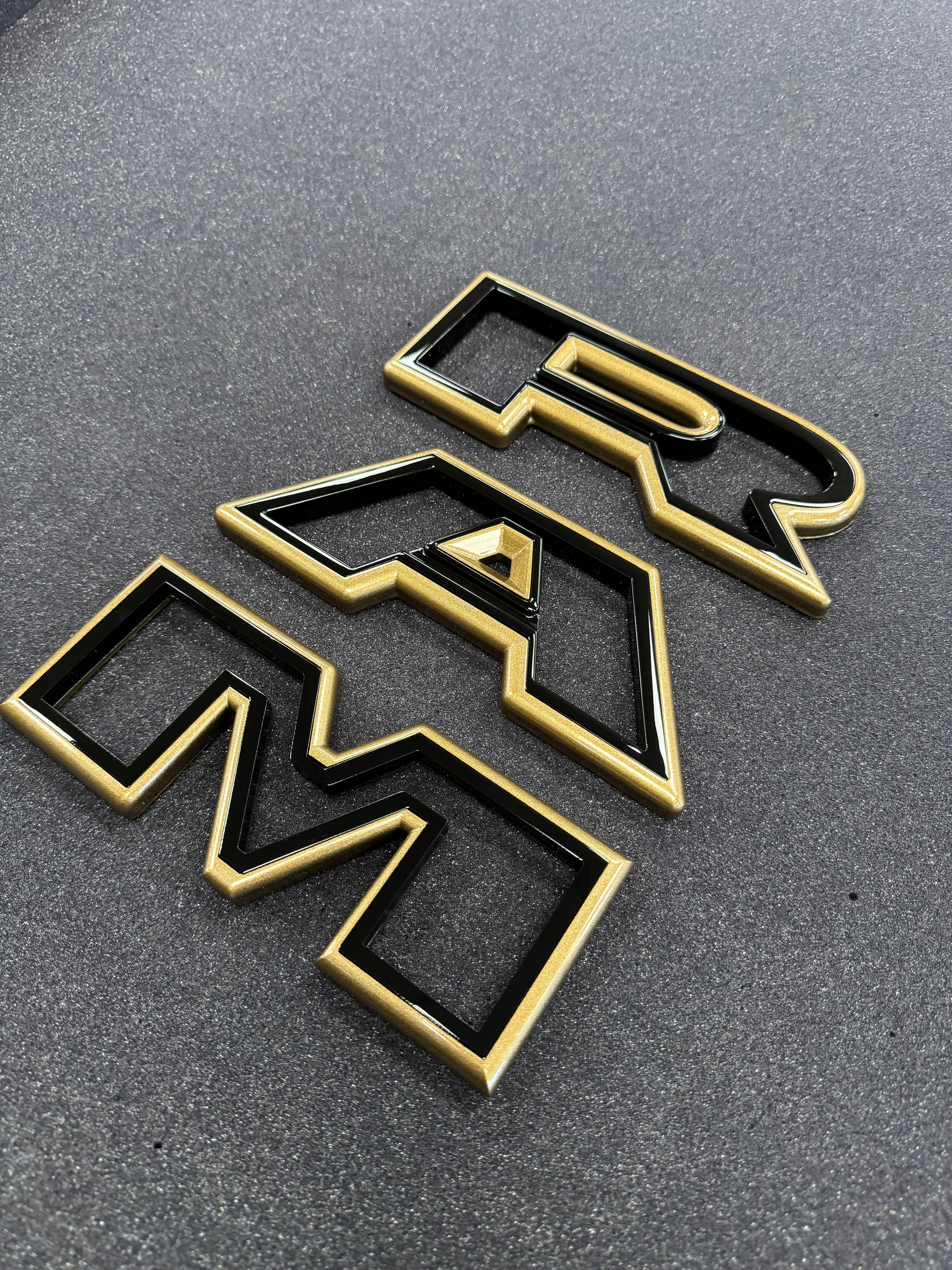 Color matched 3D RAM grille letters