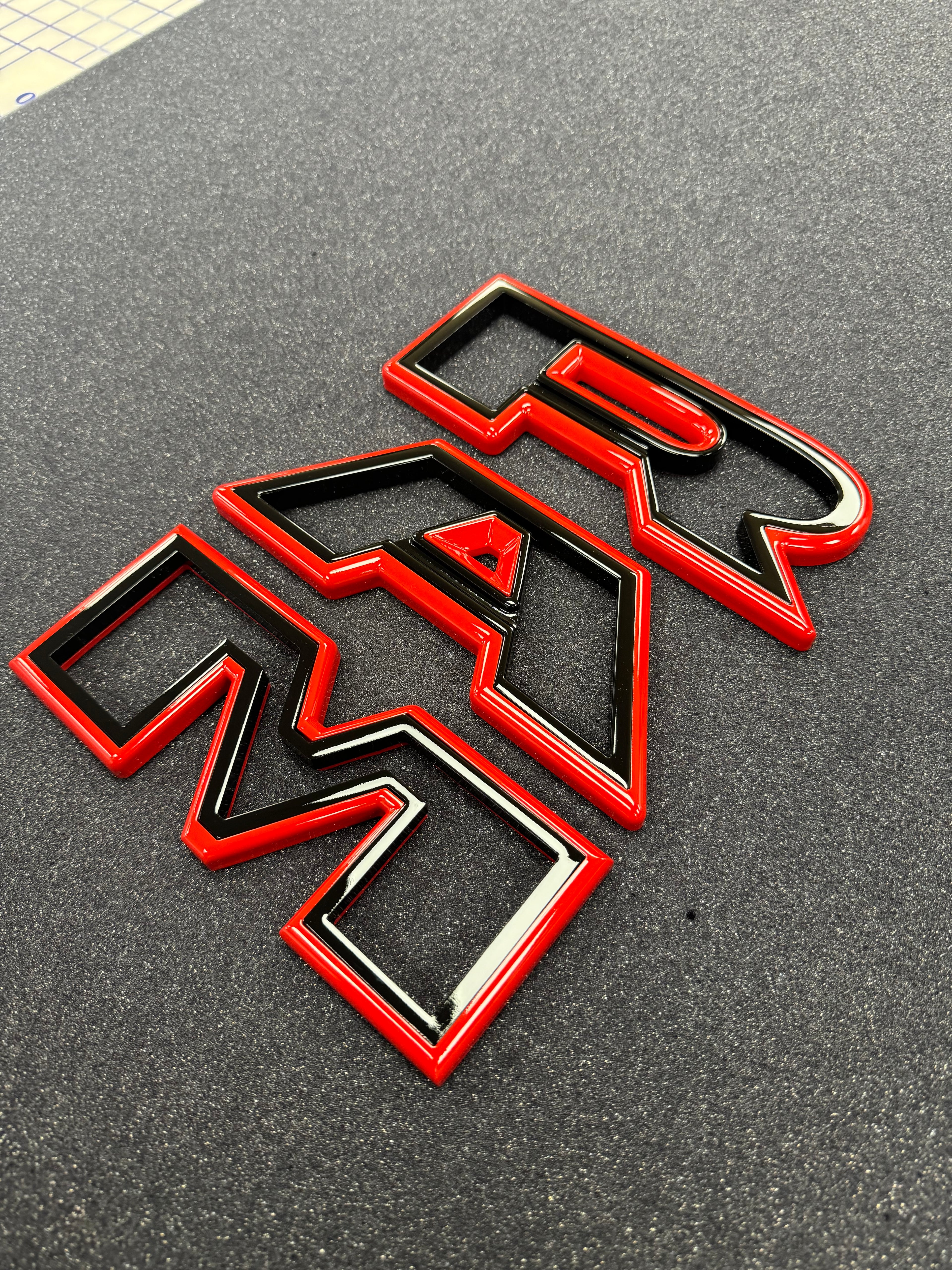 Color matched 3D RAM grille letters