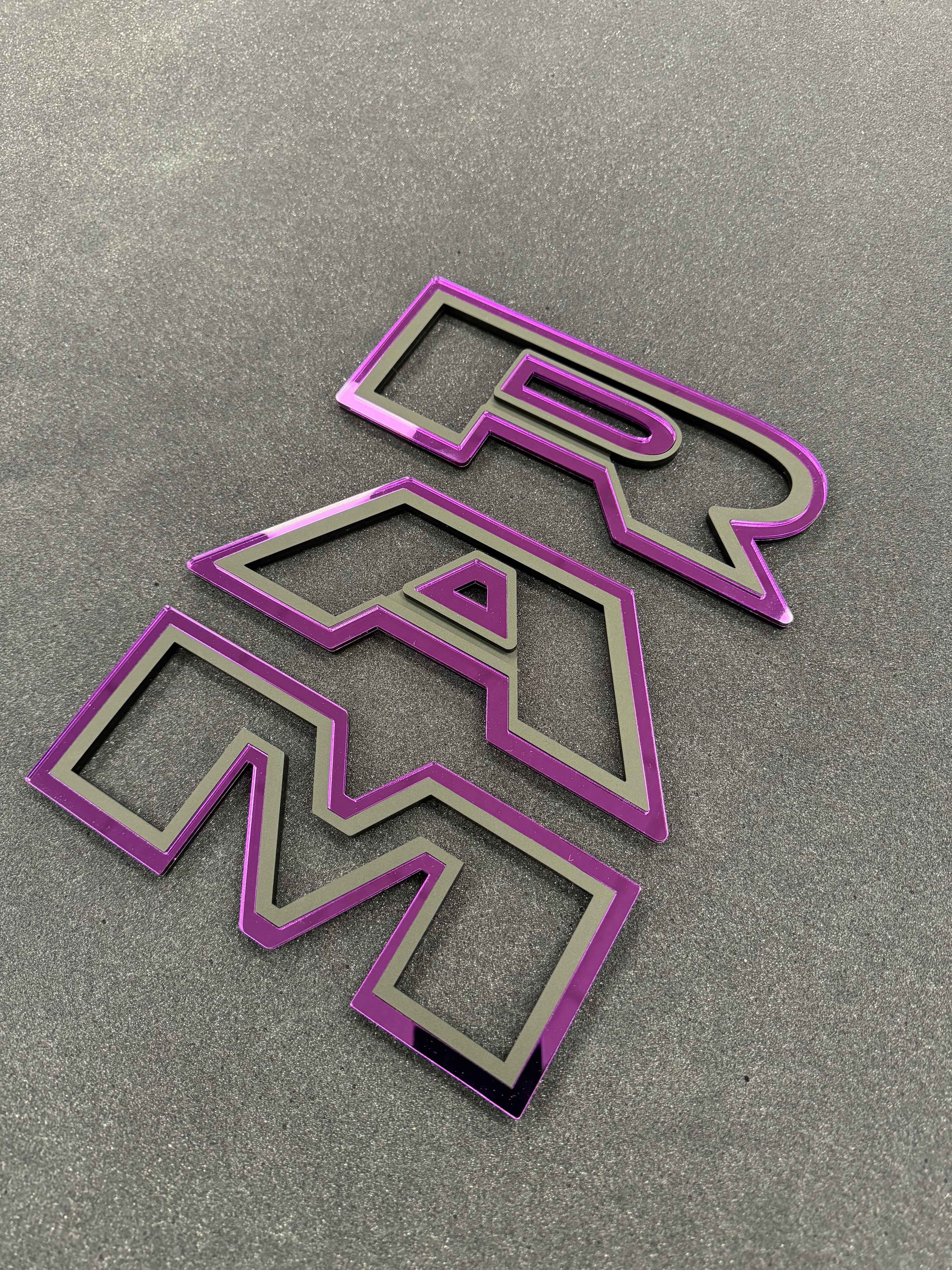 Color matched 3D RAM grille letters