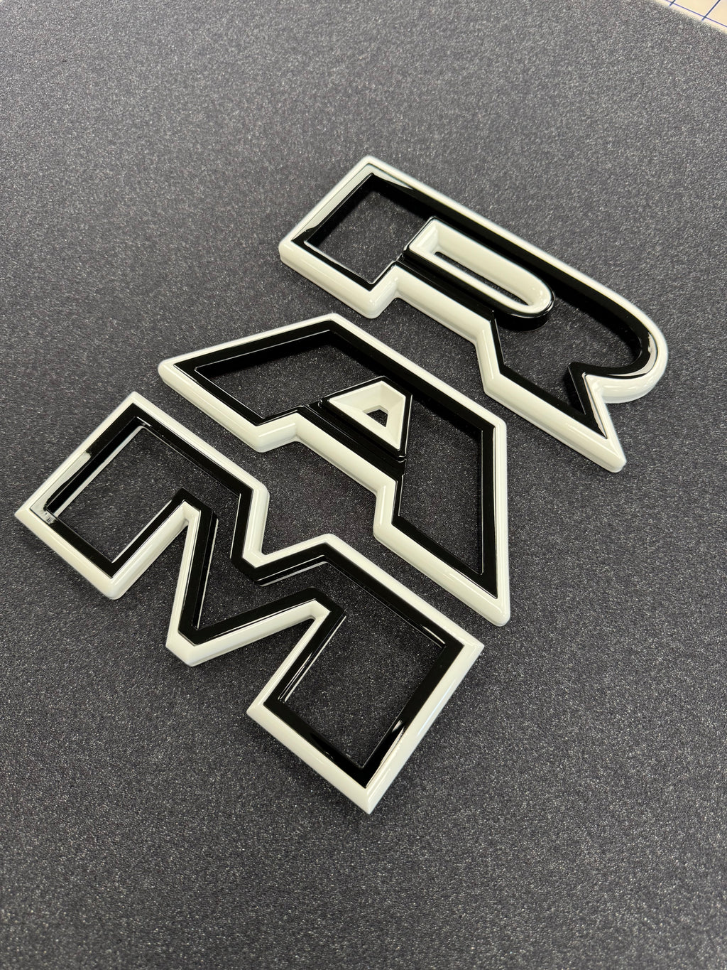Color matched 3D RAM grille letters
