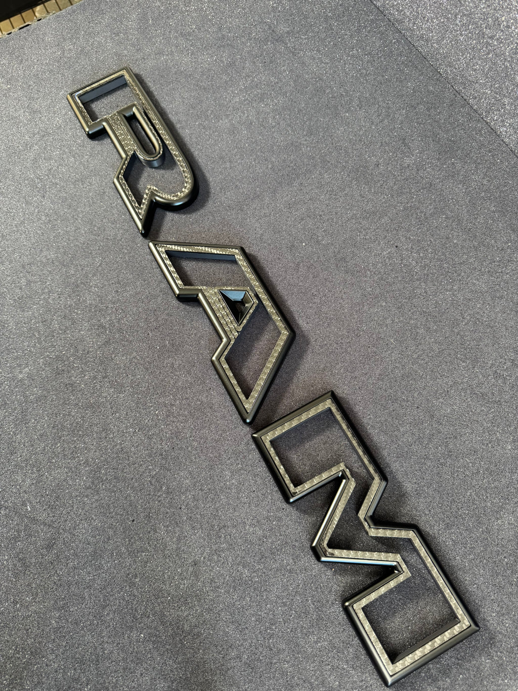 Color matched 3D RAM grille letters