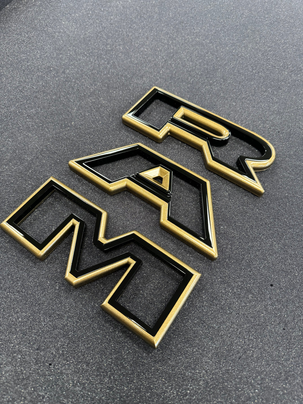 Color matched 3D RAM grille letters