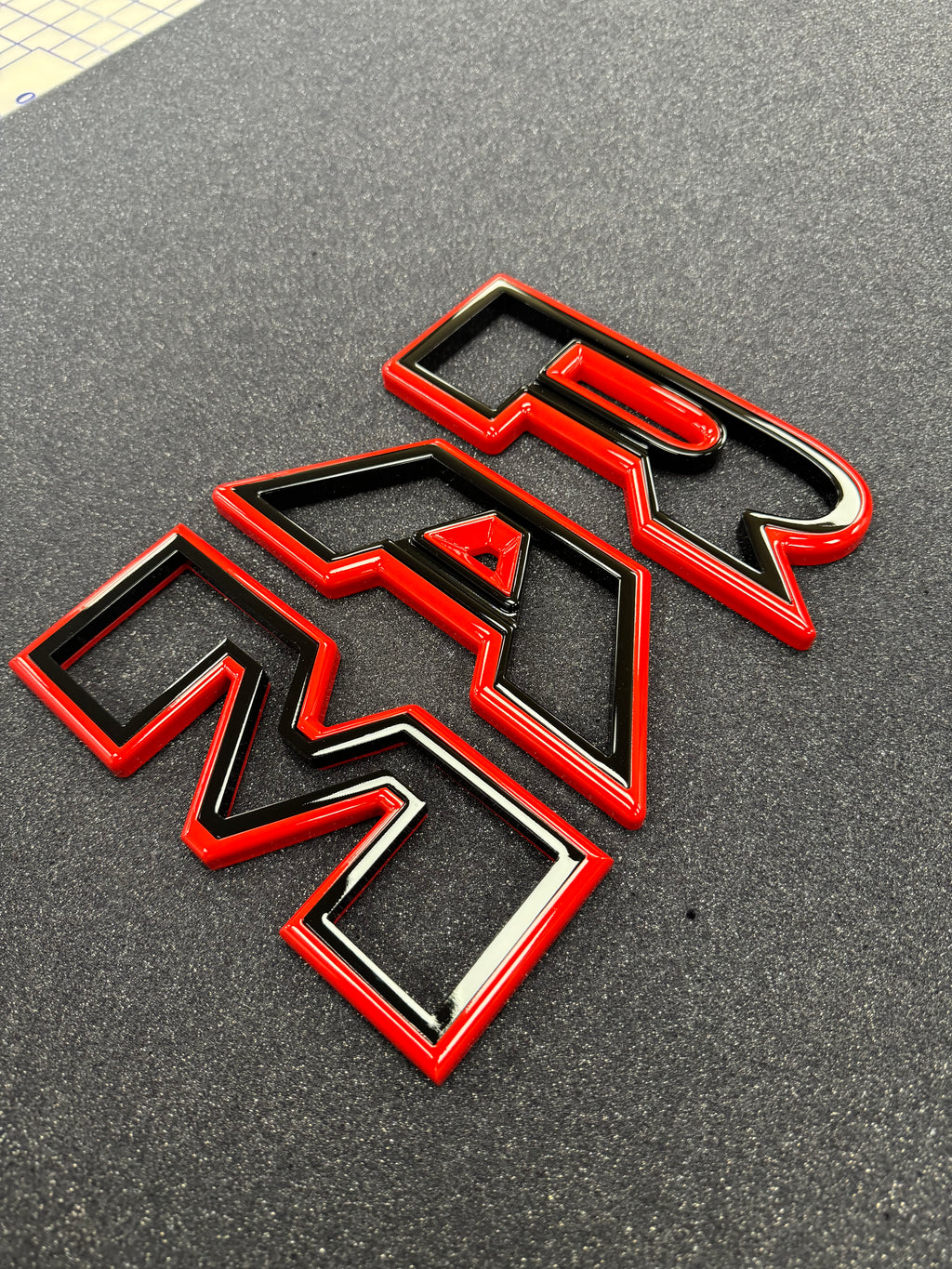 Color matched 3D RAM grille letters
