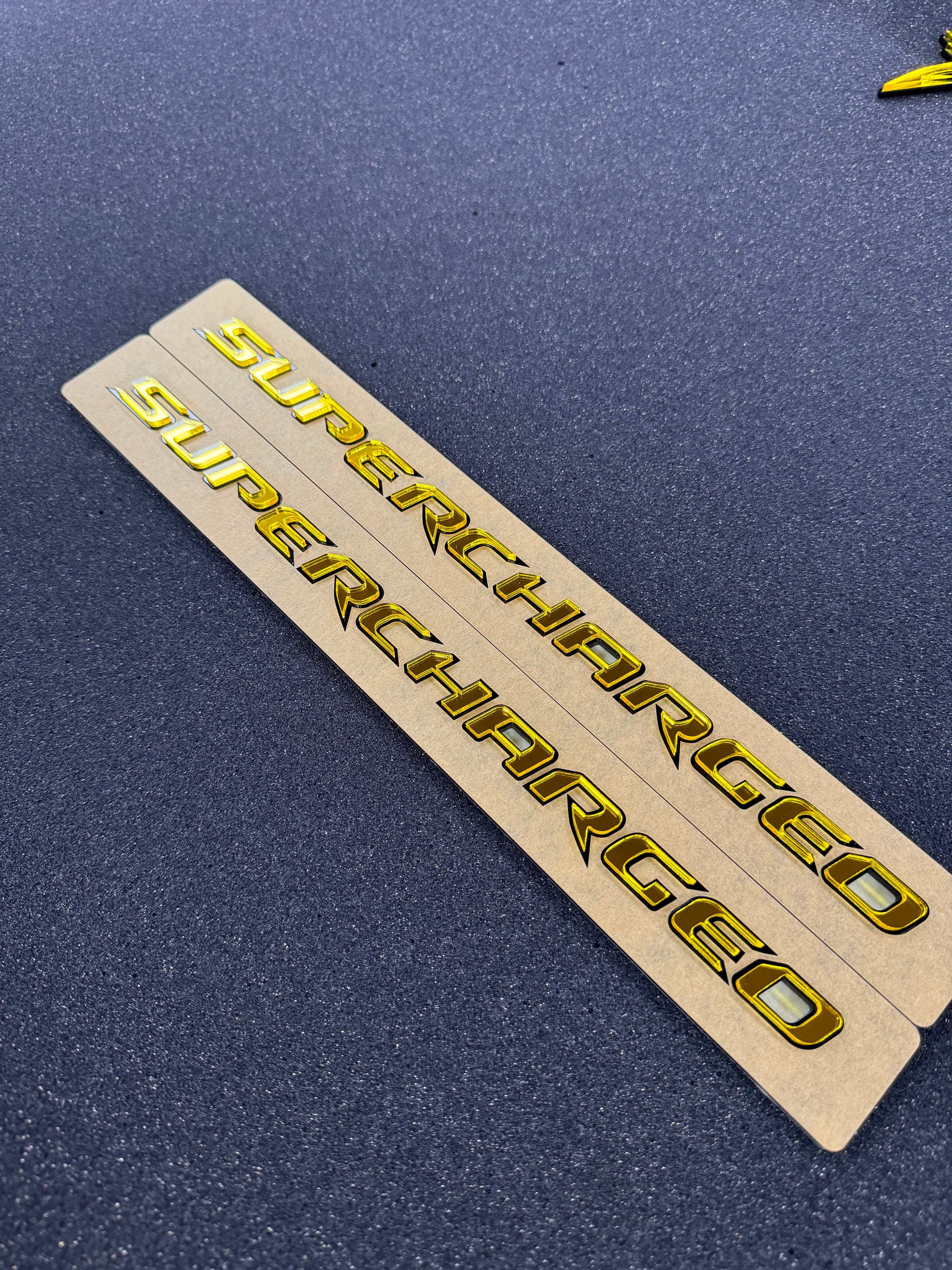 Trackhawk supercharged badge pair