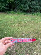 702HP badge