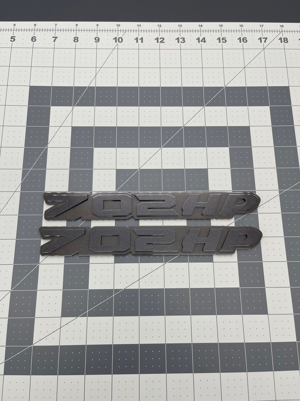 702HP grille badge