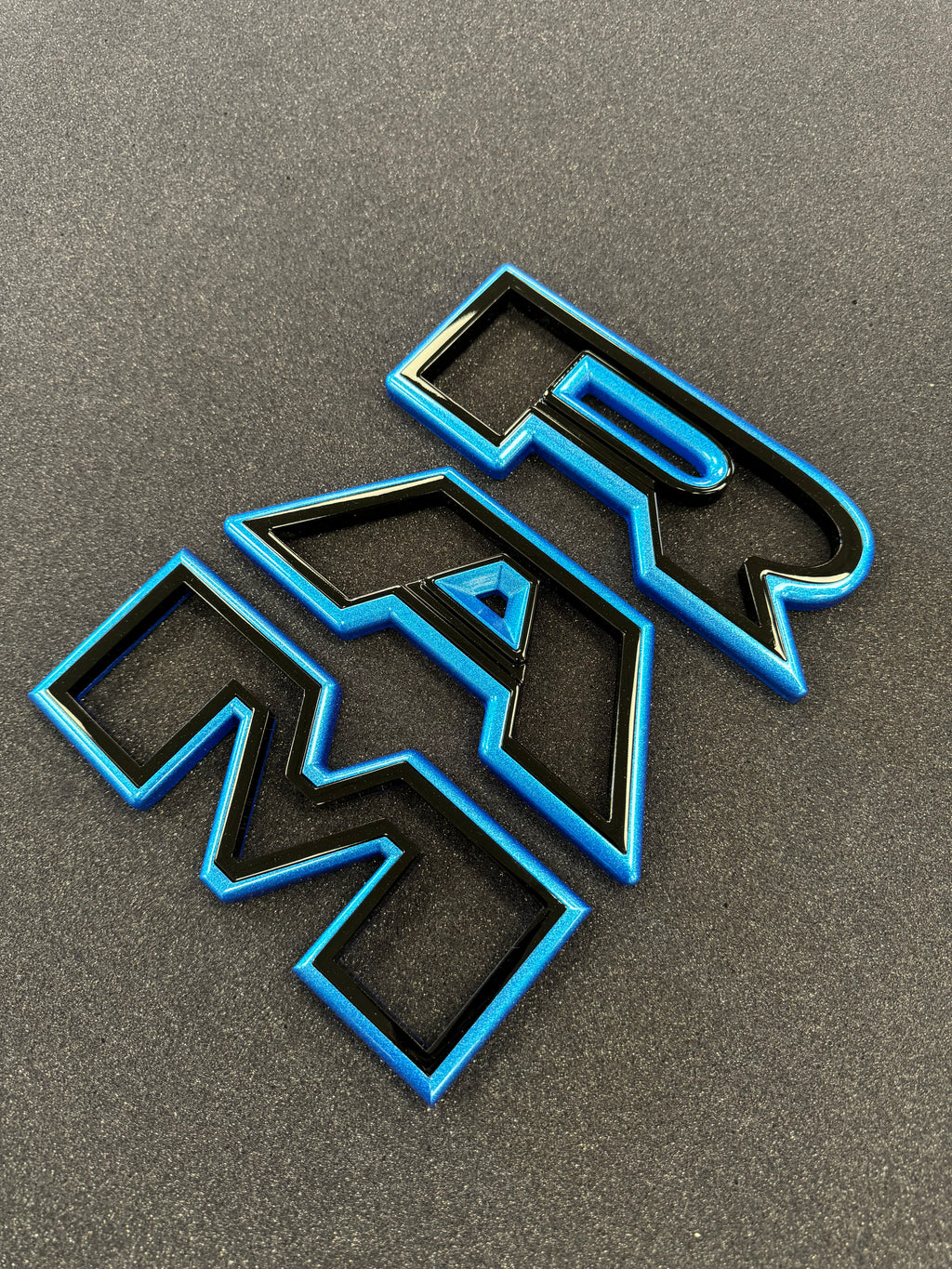 Color matched 3D RAM grille letters