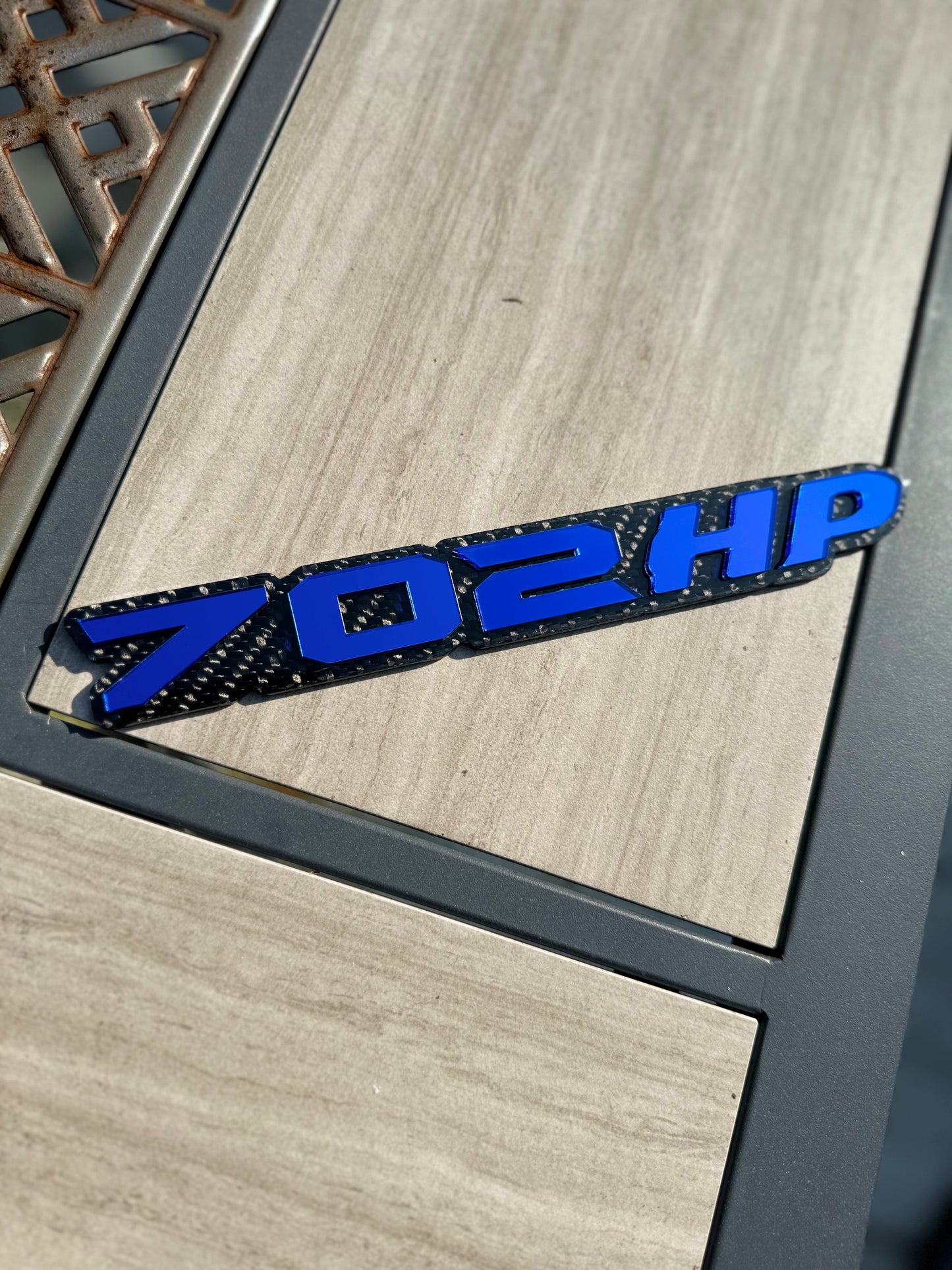 702HP grille badge