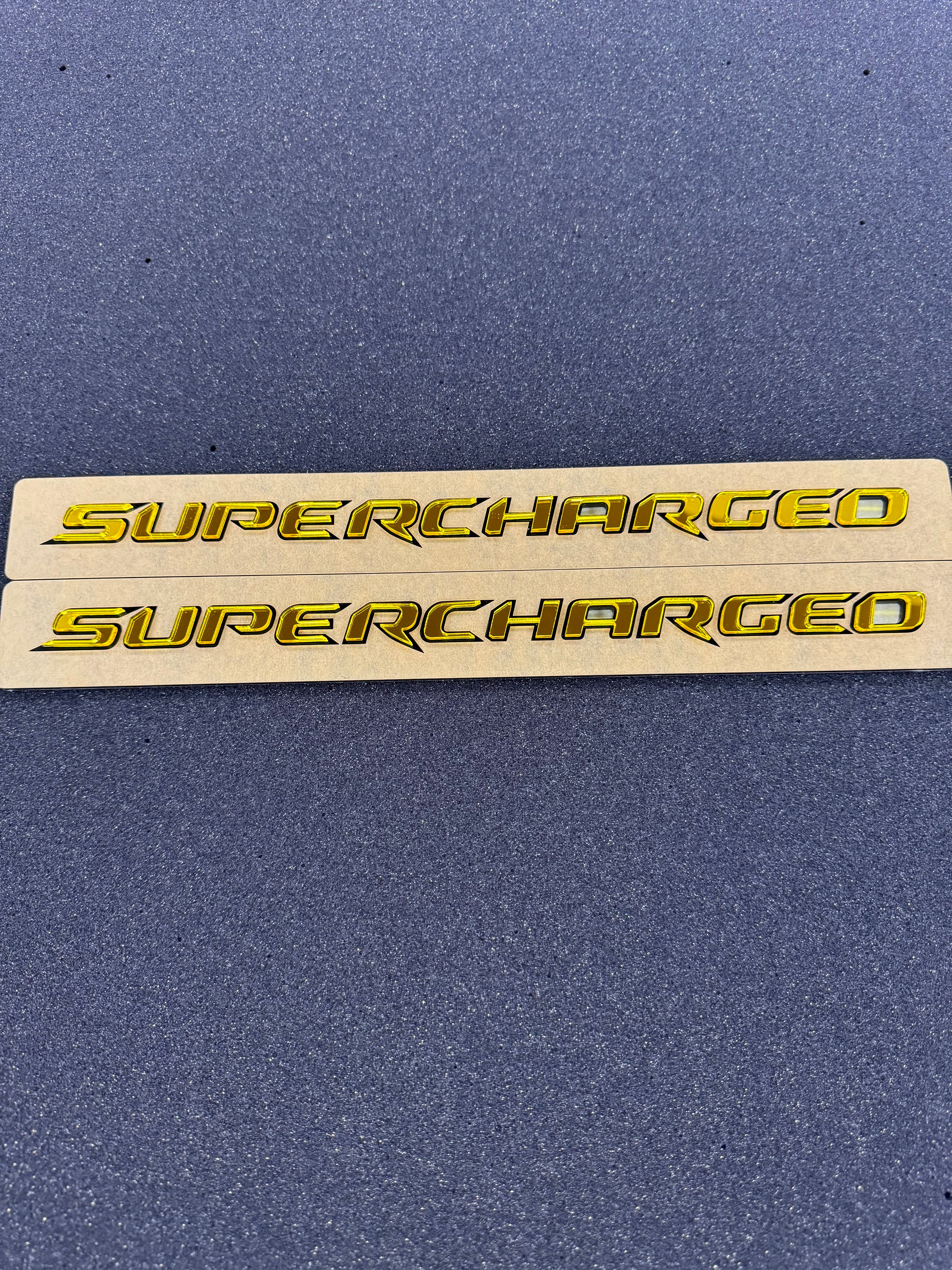 Trackhawk supercharged badge pair