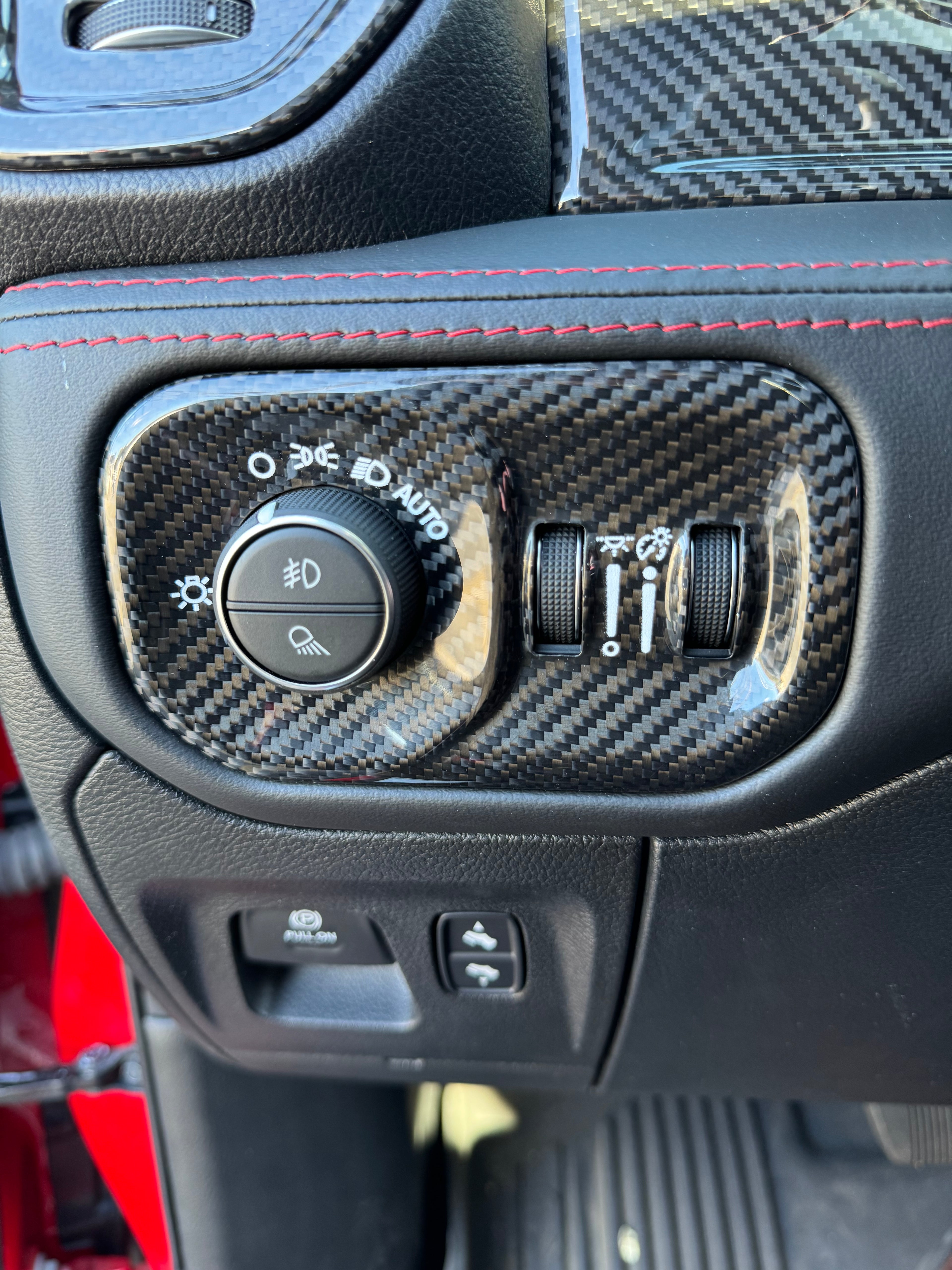 2019+ RAM 1500/ TRX / RHO carbon fiber headlight control bezel cover