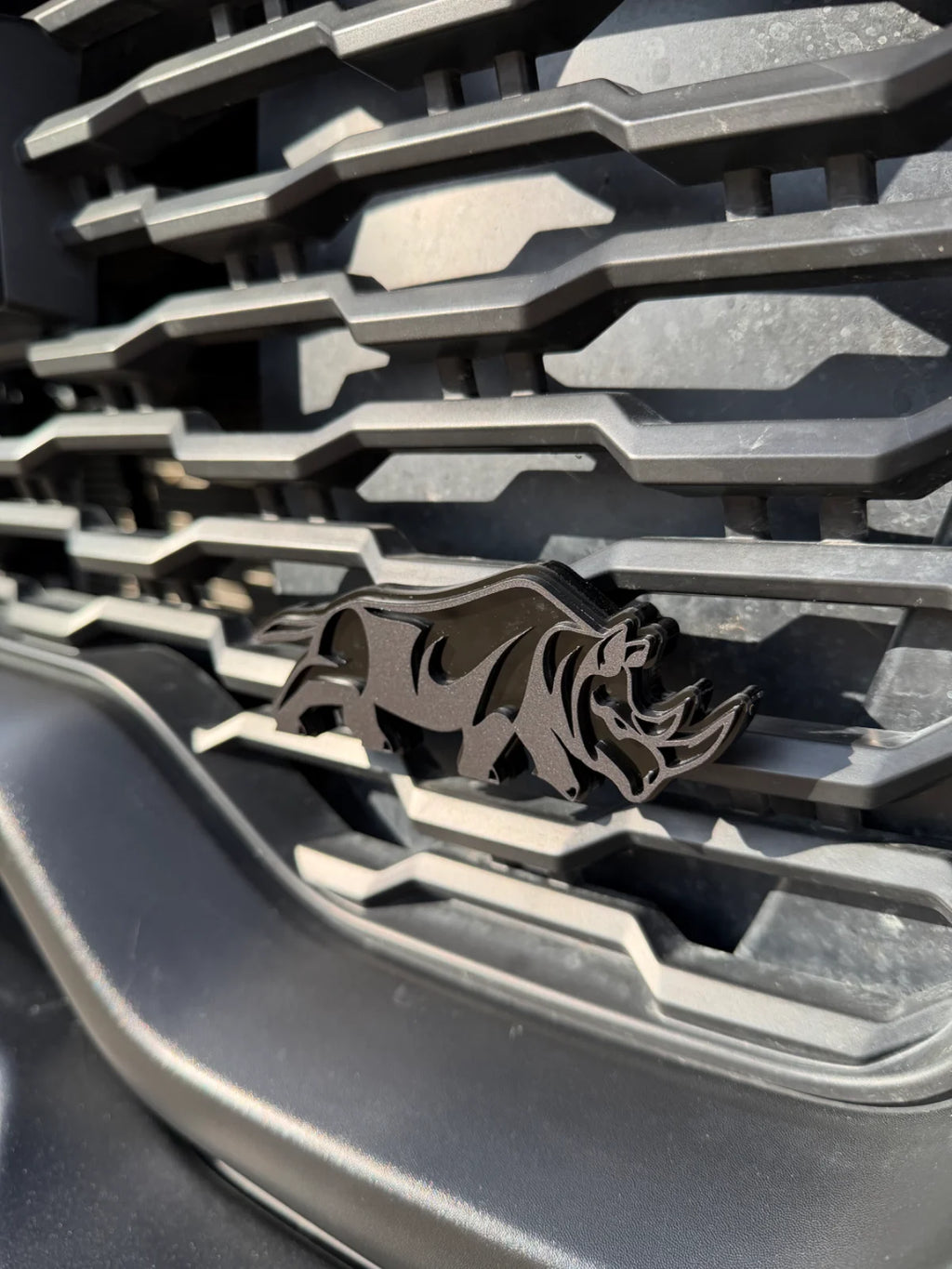 Rhino grille badge