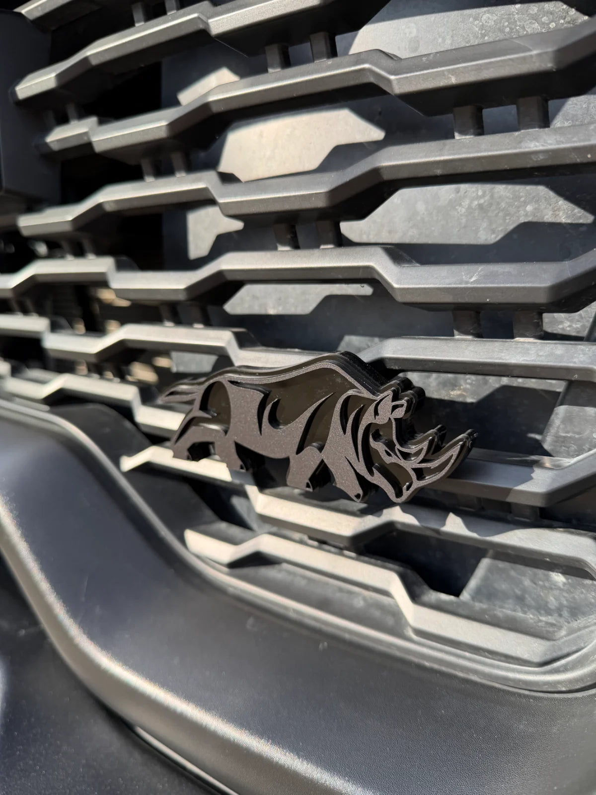 Rhino grille badge
